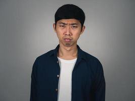 Sadness asian man feels depressed about bad life isolated photo