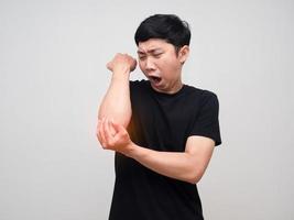 Man black shirt feels pain his elbow isolated photo