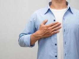 Close-up man touch his chest for lover portrait studio shot photo