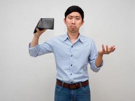 Businessman poor hold empty wallet feels sadness about no money,Poor asian man isolated photo