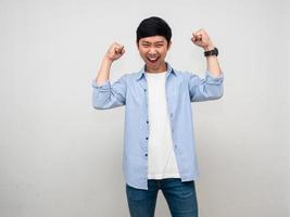 Asian businessman happiness standing fist up for successful isolated photo