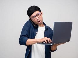 Worker man very busy talking about working with using laptop isolated photo