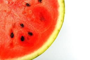 Half of juicy, red watermelon on a white background, texture of juicy pulp and mesmeses of ripe watermelon photo