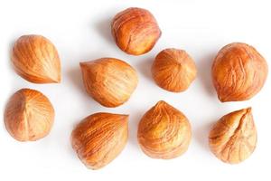 Top view of shelled hazelnuts isolated on white photo