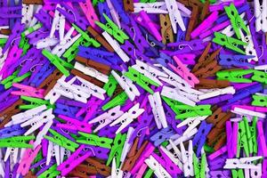 Colorful Wooden clothespins close-up as texture and background. photo