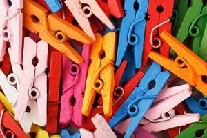 Colorful Wooden clothespins close-up as texture and background. photo