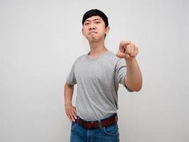 Handsome asian man looking leader gesture point finger at you confident face isolated photo