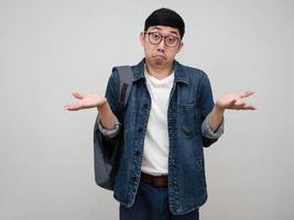 Asian positive man jeans shirt wear glasses show hands feels confused isolated photo