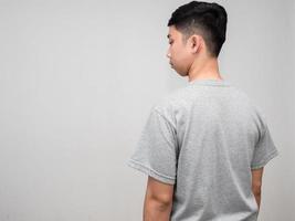 Man grey shirt turn back feels worried emotion isolated photo