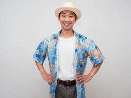 Portrait asian tourism man holiday shirt happy smile posing hand at waist isolated photo