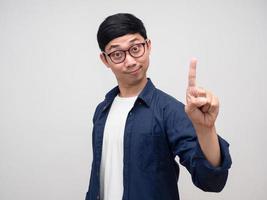 Young man wear glasses show finger up number one portrait photo