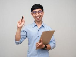 Cheerful businessman happy smile holding document board and pen isolated photo