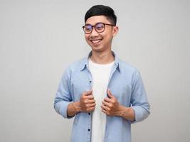 Positive asian businessman wear glasses blue shirt gentle smile portrait photo