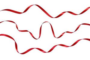 narrow red ribbons with silver stitching on a white background photo