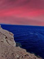 Scenic view of ocean view and mountains at sunset in Sinai, Egypt photo