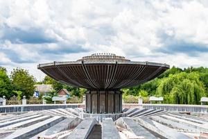 Photography on theme beautiful old fountain without water under clear sky photo