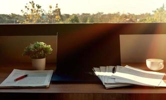 paperwork and office supplies on table photo