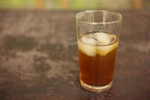 sweet fresh iced tea with blur background. photo