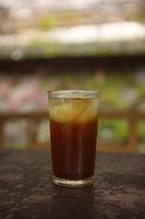 sweet fresh iced tea with blur background. photo