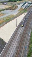 Aerial Footage of Train Tracks Passing Through Luton Town of England. Vertical and Portrait Style Video Clip Was Captured with Drone's Camera