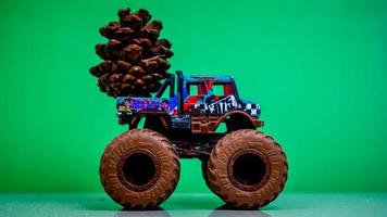 Minahasa, Indonesia  December 2022, the toy car transporting pinecones photo