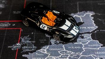 Minahasa, Indonesia  December 2022, toy car is black over the map photo