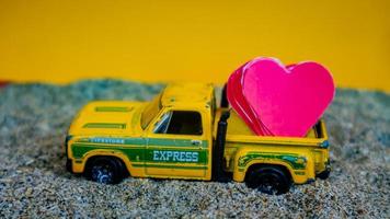 Minahasa, Indonesia  December 2022, the toy cars transporting hearts photo