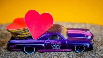 Minahasa, Indonesia  December 2022, the toy cars transporting hearts photo