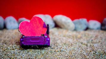 Minahasa, Indonesia  December 2022, the toy cars transporting hearts photo