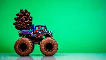 Minahasa, Indonesia  December 2022, the toy car transporting pinecones photo