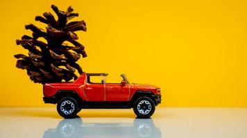 Minahasa, Indonesia  December 2022, the toy car transporting pinecones photo