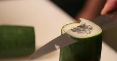 Slicing Fresh Cucumber Vertically By A Sharp Kitchen Knife. - High Angle Shot video