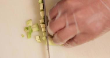 Chef Chopping Fresh Avocado For Sushi - overhead shot video