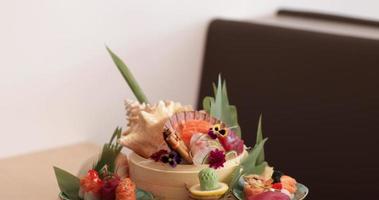 Sushi And Sashimi Rolls Arranged Creatively In A Plate In A Sushi Restaurant - tilt down shot video