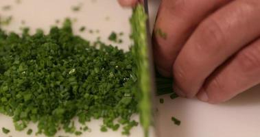 Slicing delicious green Chives for a yummy Kabuki dish - Close up video