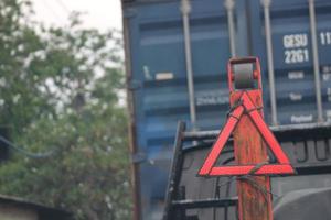 The safety triangle is a triangular sign with red sides photo