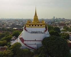 An aerial view of the Golden Mount stands prominently at Saket Temple, The most famous tourist attraction in Bangkok, Thailand photo