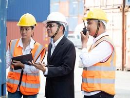 Businessman manager supervisor factory talk speak discussion work job occupation tablet smartphone mobile technology import export warehouse storage shipping container service hardhat engineer photo