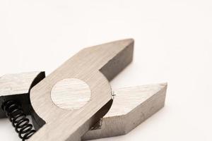 Close up pliers in white background. Selective focus. photo