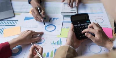 Business financial, accountant discussing with partner are meeting to audit finance planning sales to meet targets set in next year. stock market concept. photo