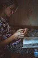 Close up young sitting with book in room portrait picture photo