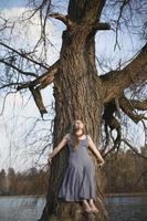 Leaning against willow tree scenic photography photo