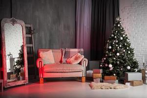 Winter home decor. Christmas tree in loft interior against brick wall. photo