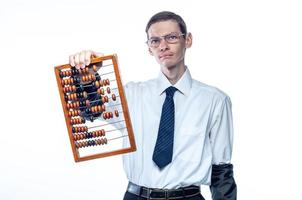 Business man in tie and glasses with bills in hand on white, isolated background photo