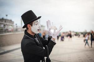 Mime on the street waiting to meet with his lover photo