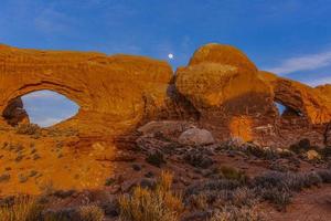 Panoramic picture of impressive sandstone formations in Arches National Park at night in winter photo