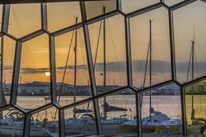 View on Reykjavik yacht harbour during sunrise in summer in evening sun photo