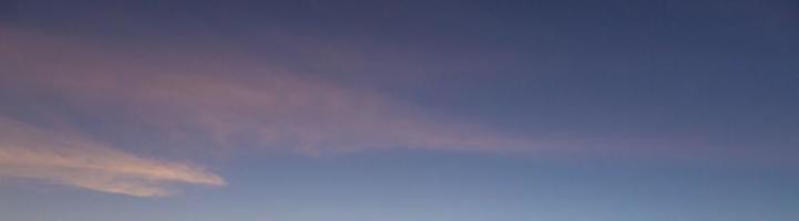 Dramatic colorful sky with afterglow and illuminated clouds photo