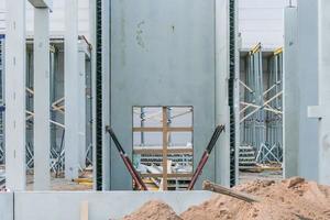 Precast concrete elements on construction site during installation process photo