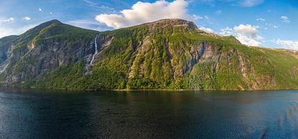 Impression from cruise ship on the way through Geiranger fjord in Norway at sunrise in summer photo